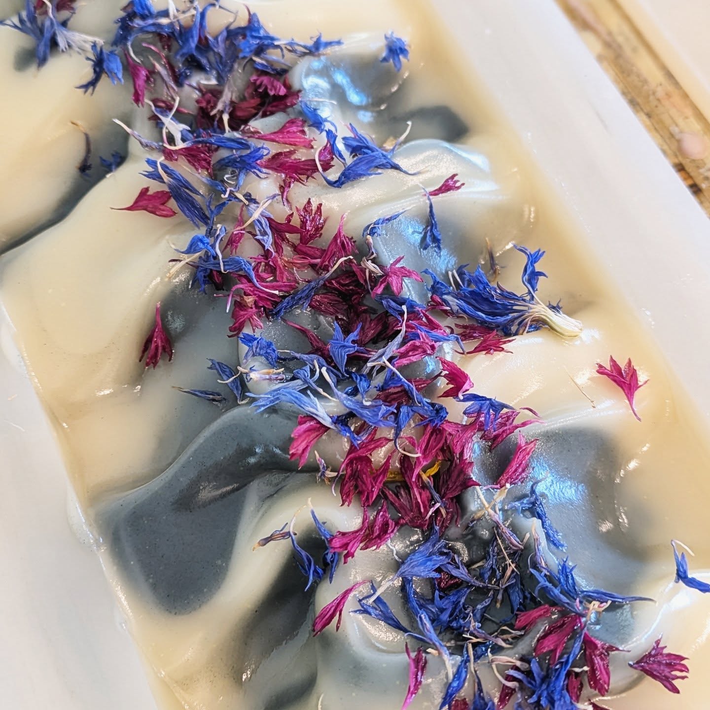 Soap bar with colorful dried flowers on top