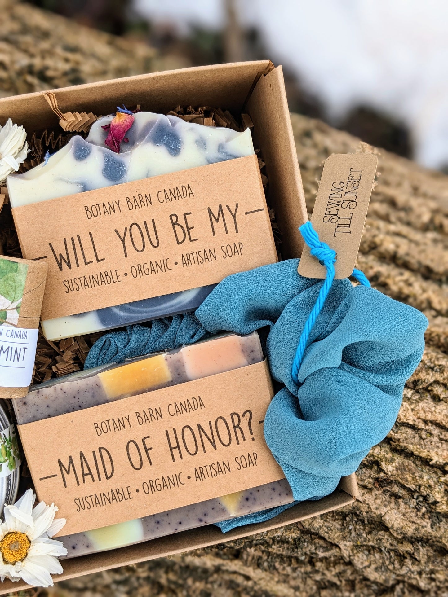 A gift set with soap bars labelled "will you be my maid of honor?"