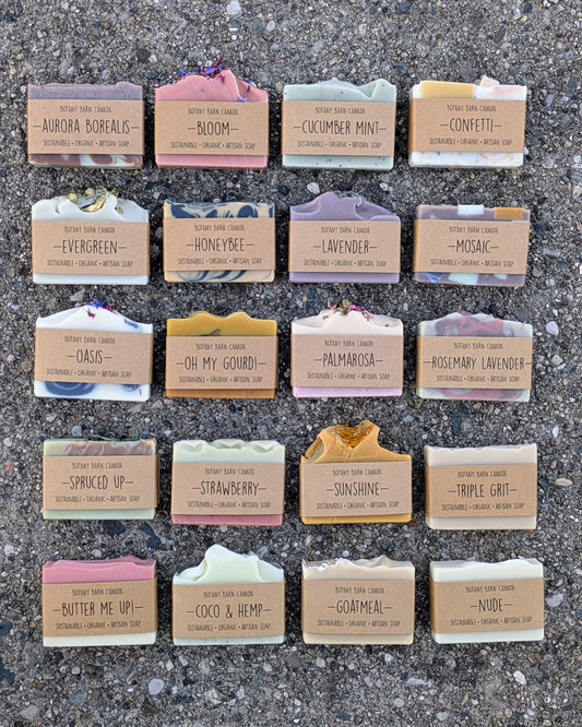 Colourful handmade soap bars with Botany Barn branding laid out in a grid.
