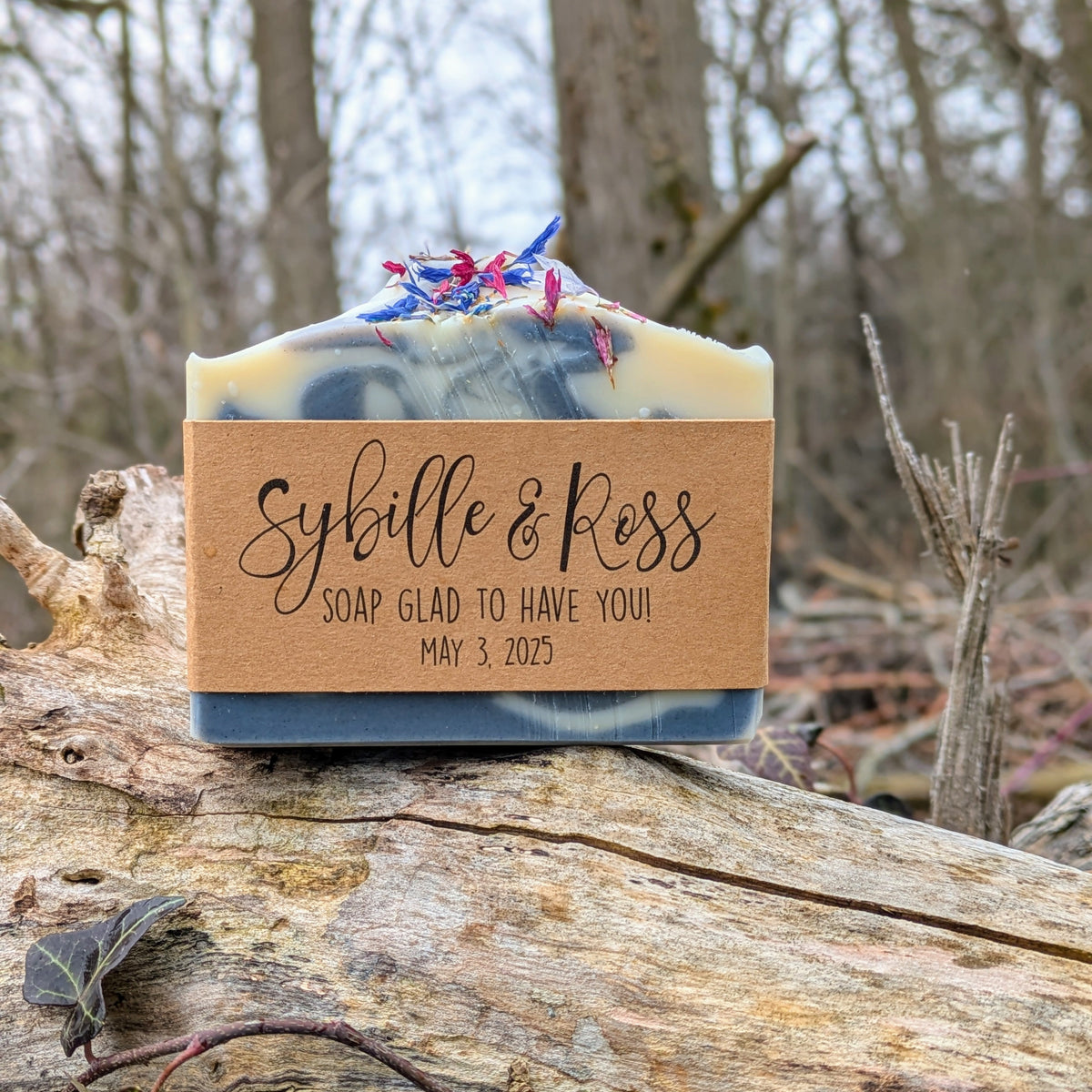 Bar of soap with a label on a wooden log in a forest setting