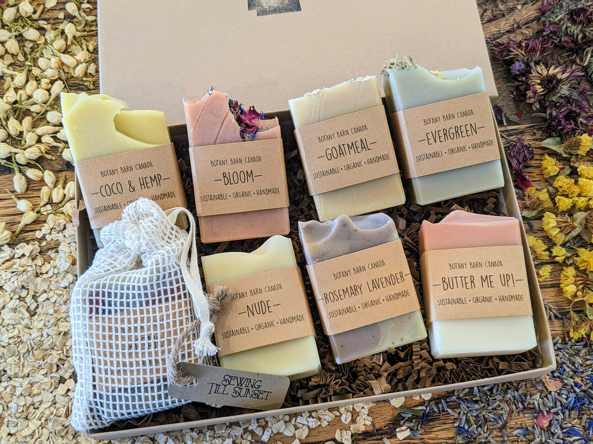 Box of assorted soaps with visible labels on a natural background