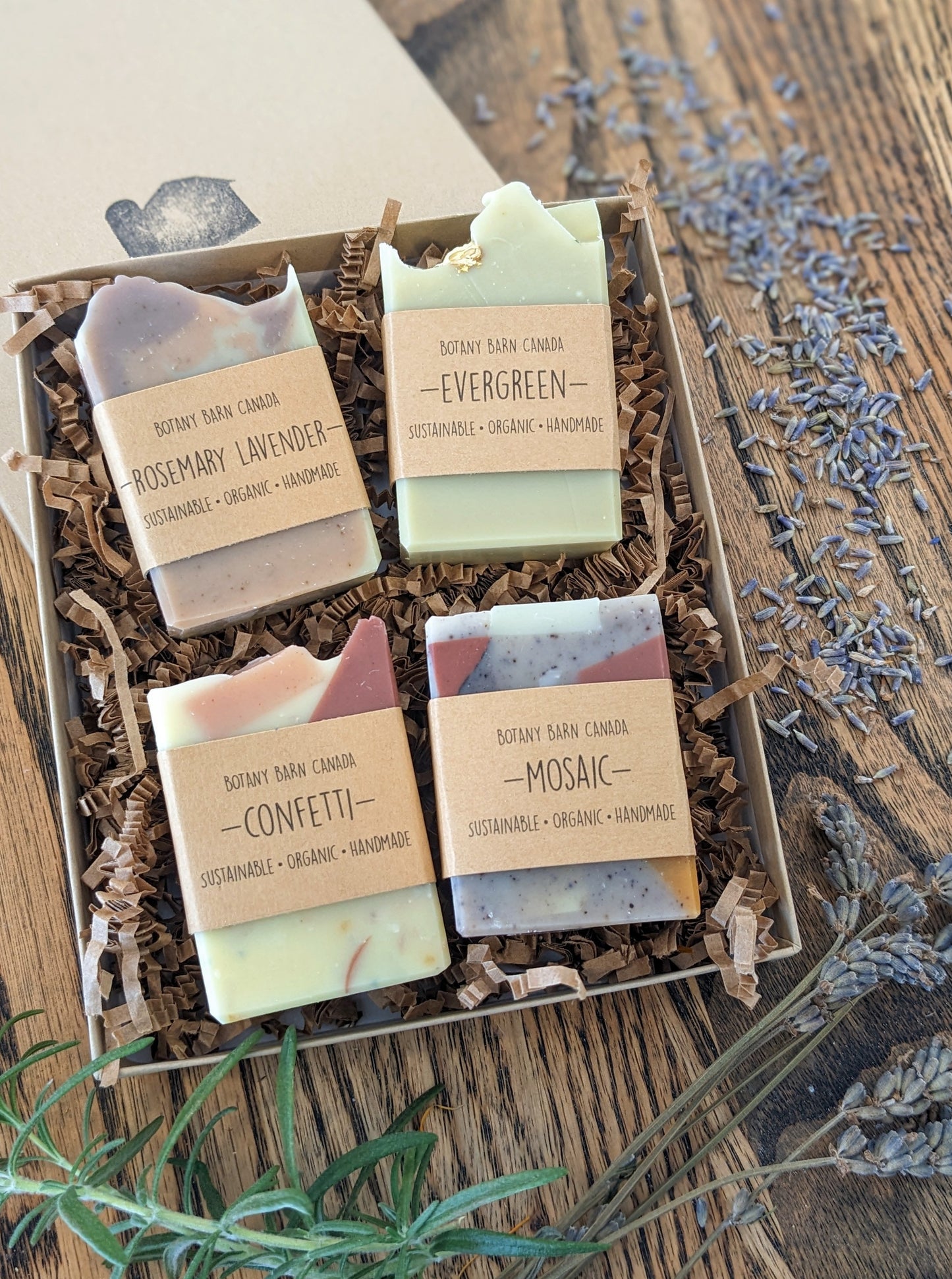 Four soap bars displayed in a gift box with Botany Barn branding
