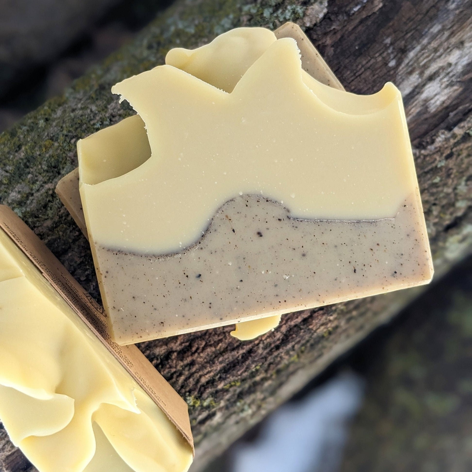 Bar of soap with a natural texture on a wooden surface