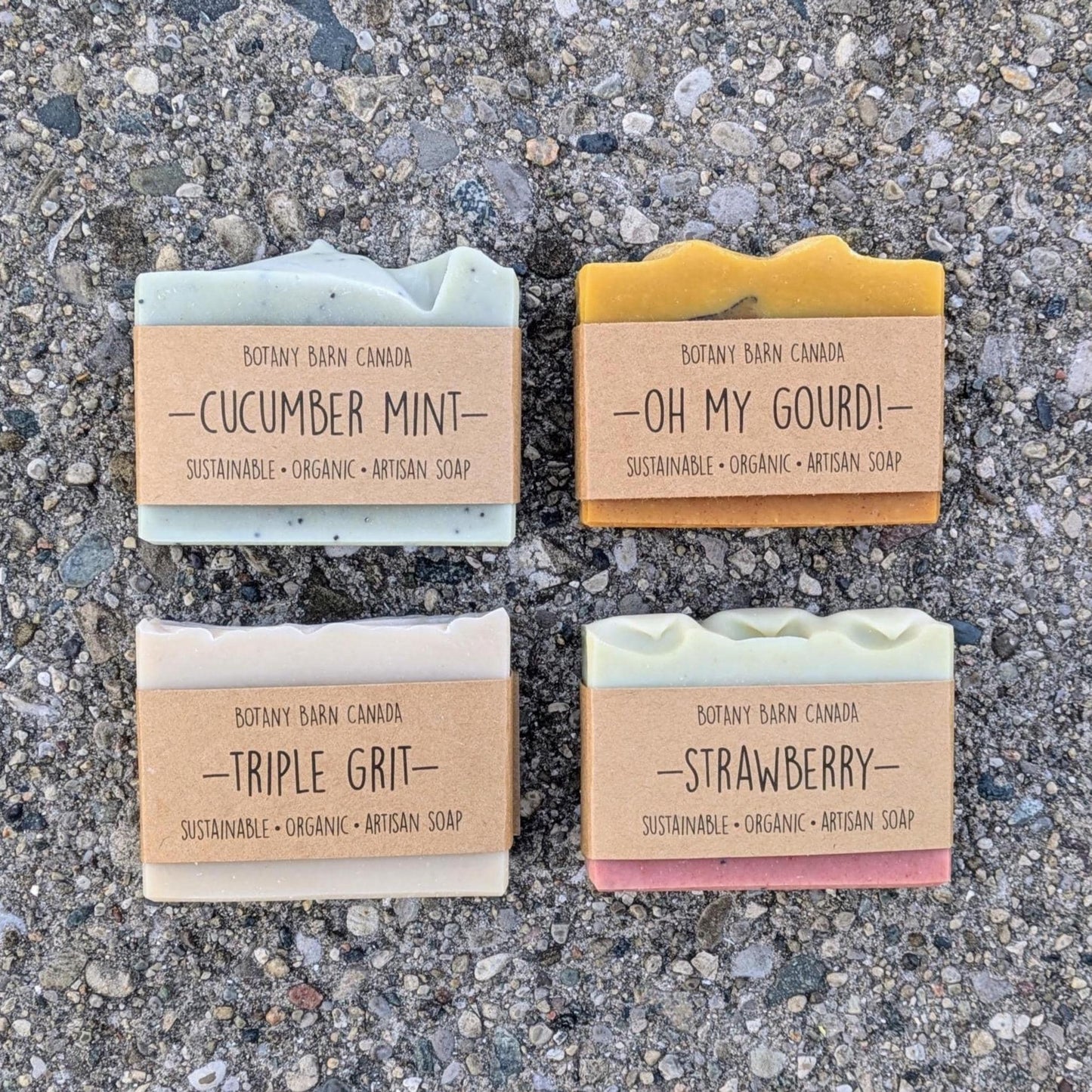 Four bars of Botany Barn Canada soap on a textured surface