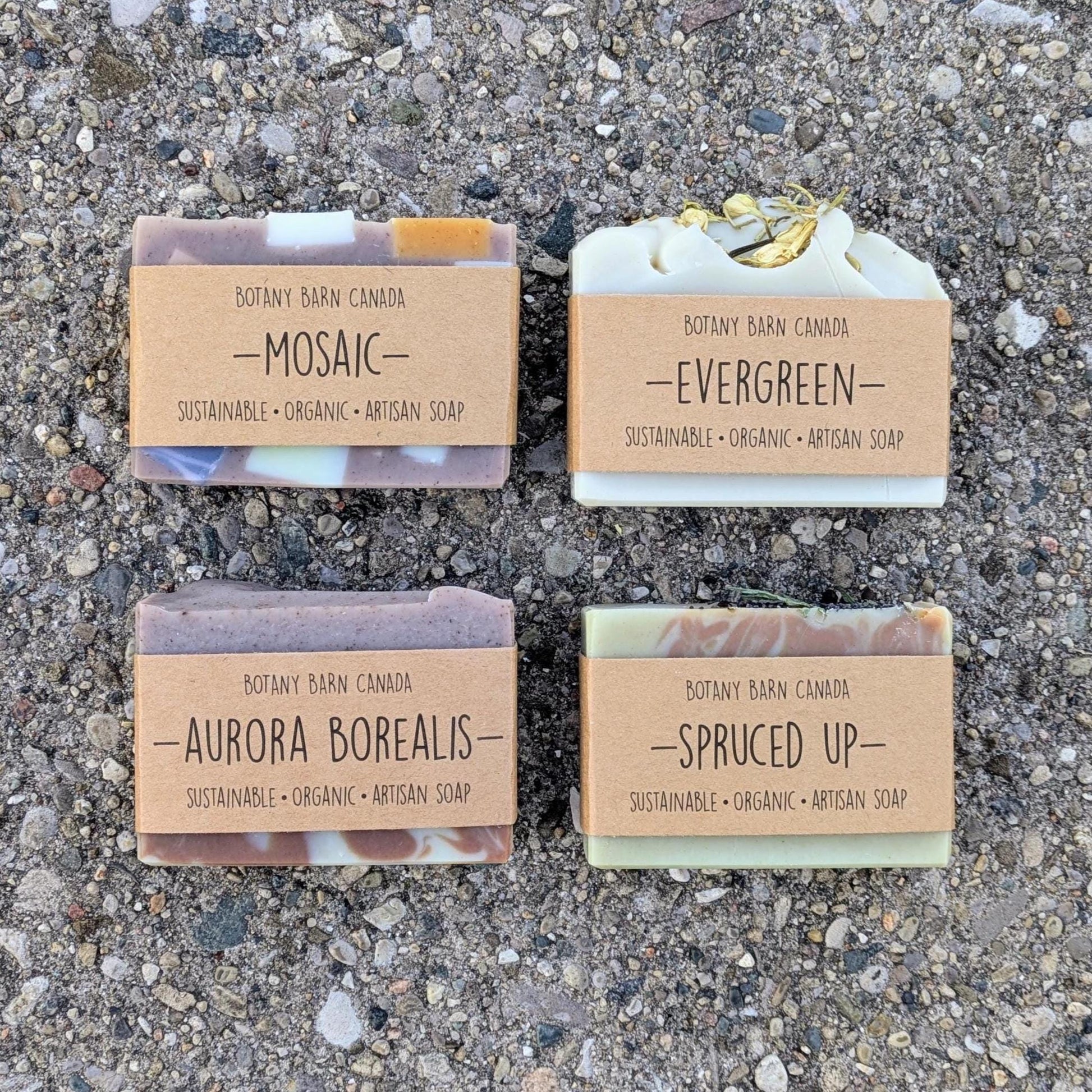 Four bars of Botany Barn Canada soap on a textured surface